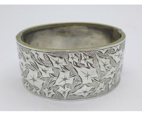 A white metal bangle, 27mm wide
