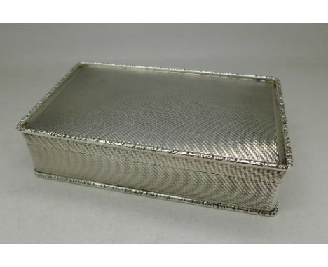 A silver engine turned cigarette case, Birmingham 1964, S.J. Rose & Son, 384g