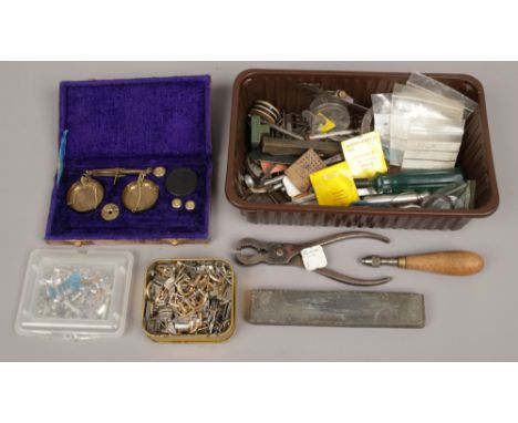 A box of watch spares, horologists tools etc along with a set of scales in case.