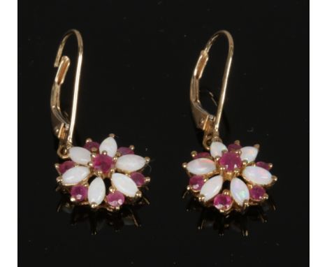 A pair of cased 9ct gold ruby and opal pendant earrings.