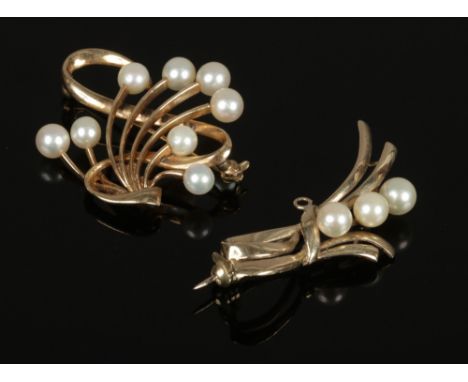 Two gold Mikimoto pearl brooches, one 9ct and one 14ct.