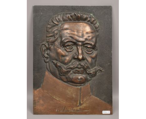 A bronze plaque entitled V. Hindenburg.