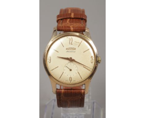 A gents Roamer standard manual gold plated wristwatch with baton and Arabic numeral markers and subsidiary seconds.