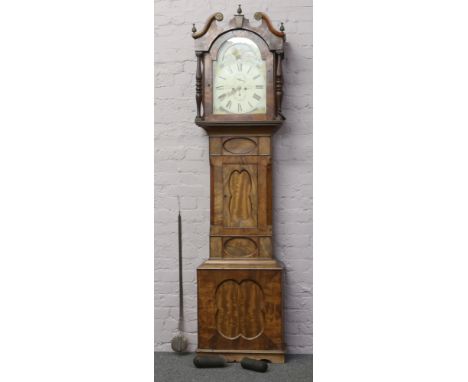 An early 19th century mahogany 8 day longcase clock by D. Newton Wortley with double swan neck pediment, moon roller seconds 