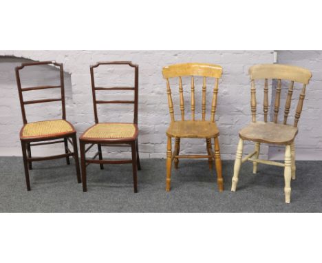 A pair of bergere seat ladder back chairs along with two spindle back kitchen chairs.
