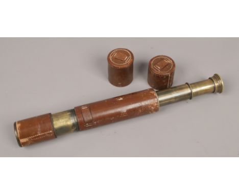 A brass telescope in leather cover makers mark for Broadhurst Clarkson &amp; Co. Ltd London.