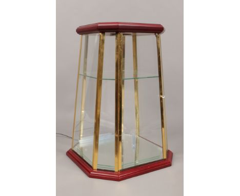 A table top light up display cabinet. (dimensions height 43cm, base width 30cm, top width 23cm)Condition report intended as a