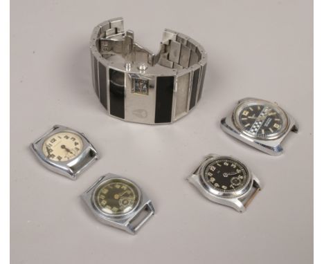 Four watch heads and one wristwatch to include Timex Ralley, Nixon Rotolog wristwatch examples etc.