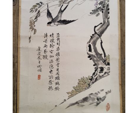 An early 20th century Chinese hanging calligraphy scroll, Qing dynasty,painted with swallows and Wisteria, inscribed and seal