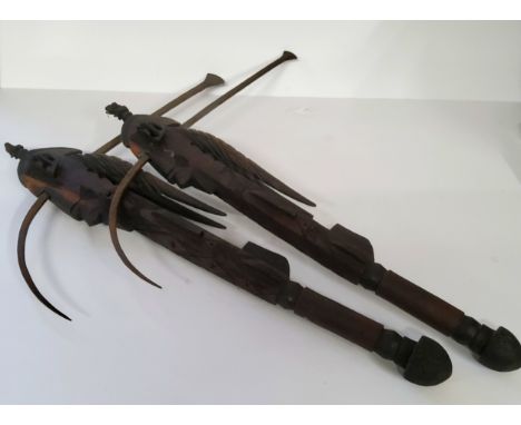 An unusual pair of African ceremonial axes, Shona tribe, the human face with curved steel axe with antelope horn details, the