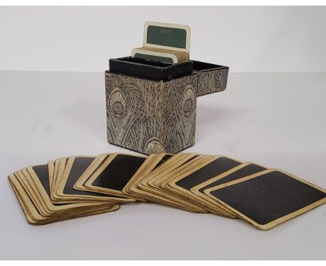 A Liberty of London playing card case containing two sets of playing cards 