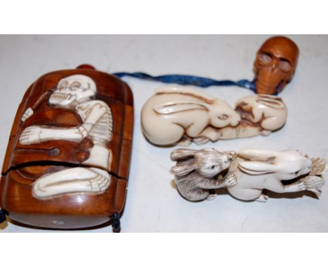 A reproduction Chinese four section inro; together with two reproduction netsuke in the form of rabbits (3) 