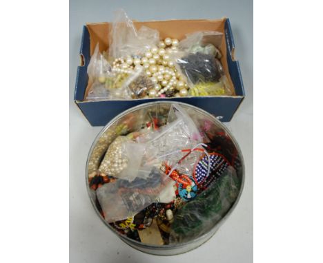 Two boxes of miscellaneous costume and other jewellery to include; faux pearl necklace etc 