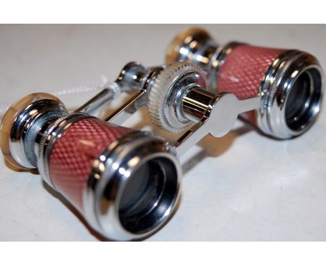 A pair of mid 20th century French steel and mother-of-pearl opera glasses