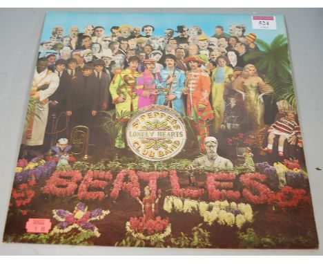 A collection of long playing records to include; The Beatles Sergeant Pepper's Lonely Hearts Club Band 