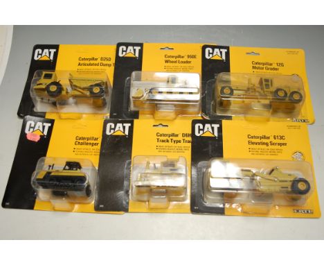 Seven Ertl boxed Caterpillar diecast toy vehicles to include; elevating scraper, tractor, articulated dump truck etc 