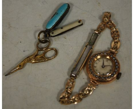 A ladies yellow metal (probably 9ct gold) and seed pearl set cocktail watch, having manual wind movement; and two miniature p