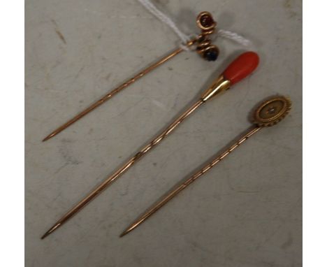 A 14ct gold diamond point set tie-pin; and two other yellow gold and semi precious set tie-pins (3)
