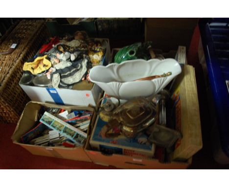 A large collection of miscellaneous items to include; modern dolls, Matchboxes, silver plated teapot, boat shaped vase, wicke