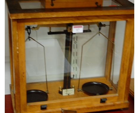 A pair of mid 20th century oak cased laboratory scales by Phillip Harris Ltd of Birmingham