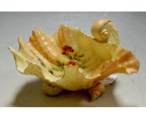 A Royal Worcester Nautilus shell dish decorated with sprays of flowers on a blush ground shape G971 green backstamp, early 20
