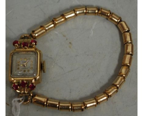 A ladies Spera 14ct yellow gold cased cocktail watch, having manual wind movement and ruby set case, on gilt metal expanding 