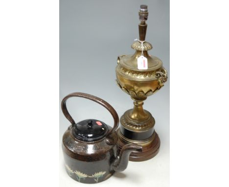 A late 19th century copper lamp base with ram mask terminals, converted for electricity ***only***