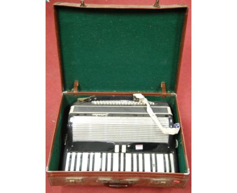 A large early 20th century Geraldo piano accordion, cased 