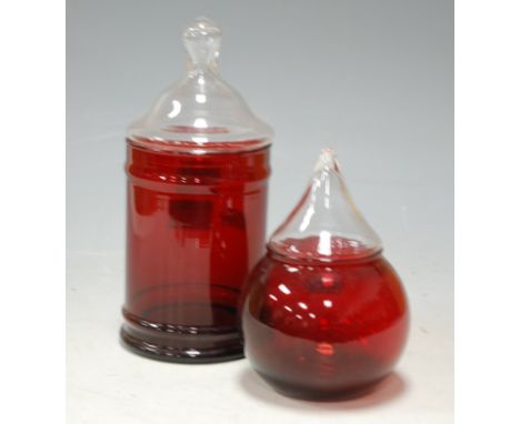 A modern ruby glass jar and cover, and one other spherical example (2)