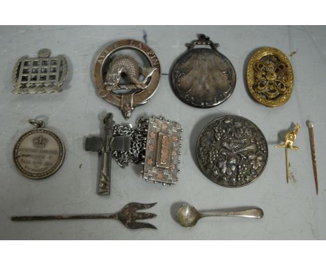 An early 20th century white metal portcullis brooch stamped verso R Lavender Hill together with various other silver and whit