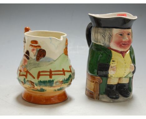 A Thorens 'Widdicombe Fair' musical jug, and one other of a seated Toby playing 'Jingle Bells' (2)