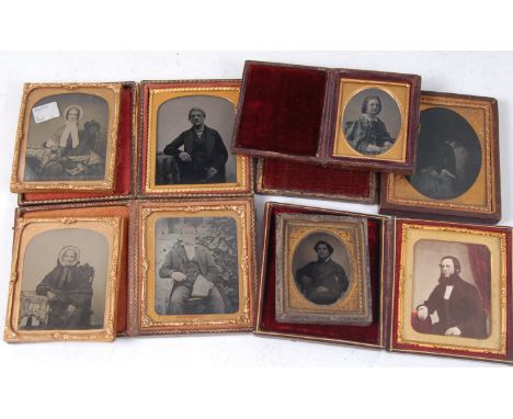 A collection of Victorian portrait ambrotypes, some in velvet-lined leather cases, none with photographers labels, one as a m