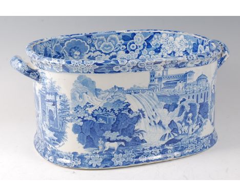 An early 19th century Don Pottery blue and white printed foot-bath, decorated with 'Views of Italy', having twin handles, imp