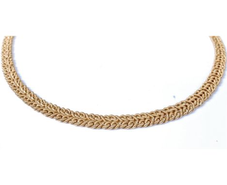 An 18ct collarette, the plaited rope style necklace with concealed box clasp and safety catch, stamped '750', 44cm long, (46.