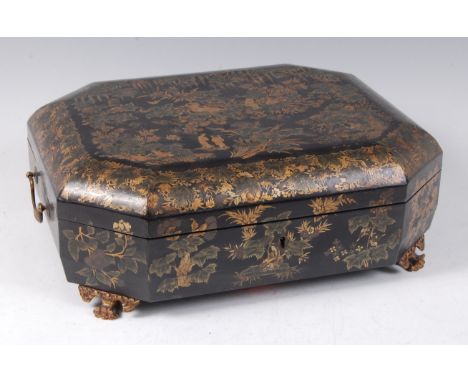 An early 19th century chinoiserie lacquered needlework box, the hinged cover decorated with Oriental figures amidst flowers a