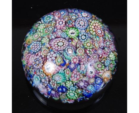 A *Perthshire Paperweights* millefiori paperweight, the close packed canes featuring a horse and a panda, approx. 5.5cm diame