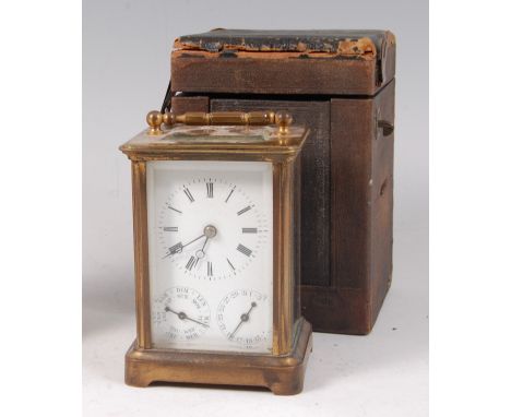 A circa 1900 lacquered brass cased triple dial carriage clock, the main dial with Roman numerals, having subsidiary day and d