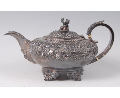 A George IV teapot, of squat circular form, the shoulders with leaf and flower chased decoration, the finial as a Chinese ric