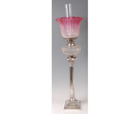 A late Victorian silver plated Corinthian column pedestal oil lamp by Walker & Hall, having pink tinted acid etched handkerch