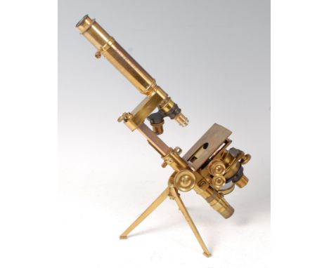 A 19th century brass monocular microscope, by Powell & Lealand of 170 Euston Road, London, incomplete but with tripod foot, m