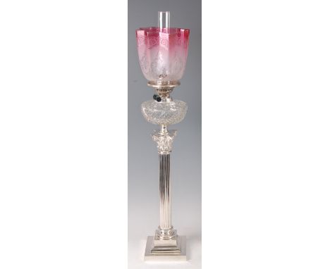 A silver plated Corinthian column pedestal oil lamp, having pink tinted acid etched and floral decorated handkerchief glass s