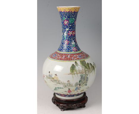 A Chinese porcelain famille vert vase, probably Qianlong (1736-1795), having waisted neck, decorated in bright enamels with f