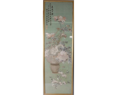 A 19th century Chinese silkwork panel, depicting basket of flowers and foliage, with script to upper left and two further sea