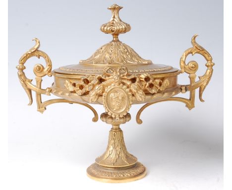 A late 19th century ormolu pedestal bowl and cover, having twin acanthus leaf capped handles, the frieze adorned with ribbons