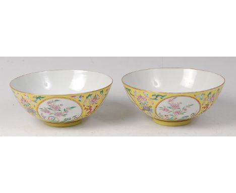 A pair of Chinese Republic period porcelain footed bowls, each of circular form, enamel decorated to a yellow ground with cir