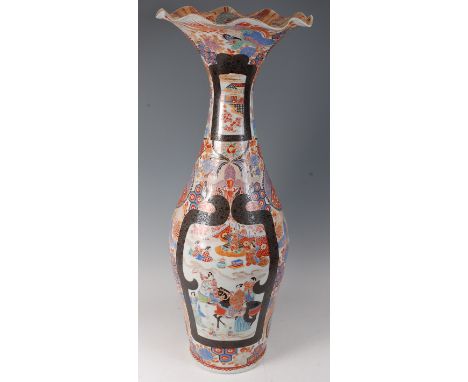A large Japanese late Meiji period floor vase, having a wavy rim and of mid-baluster form, bright colour enamel decorated wit