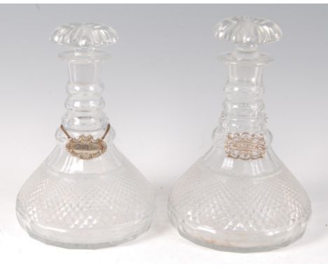 A pair of circa 1830 triple ring-neck ships decanters, each with mushroom stoppers and star-cut bases, h.25cm   Condition Rep