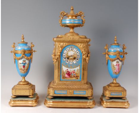 A mid-19th century French gilt metal and porcelain three piece clock garniture, the clock surmounted with a pedestal urn, hav