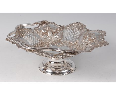 A late Victorian silver pedestal basket, having swing carry handle, the lobed sections each chased with leaves and flowers, 2