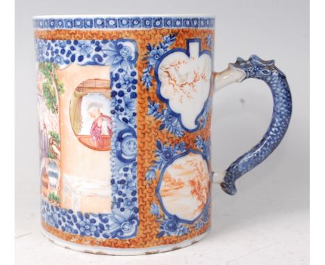 An 18th century Chinese famille rose tankard, decorated in polychrome enamels with extensive figure landscape scene within an
